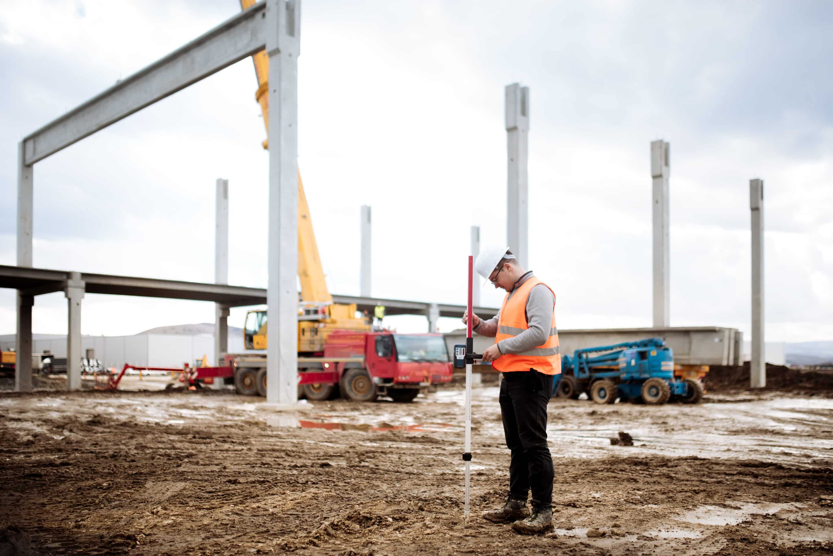 Close up details of construction site, industrial civil engineer working with prefabricated cement pillars