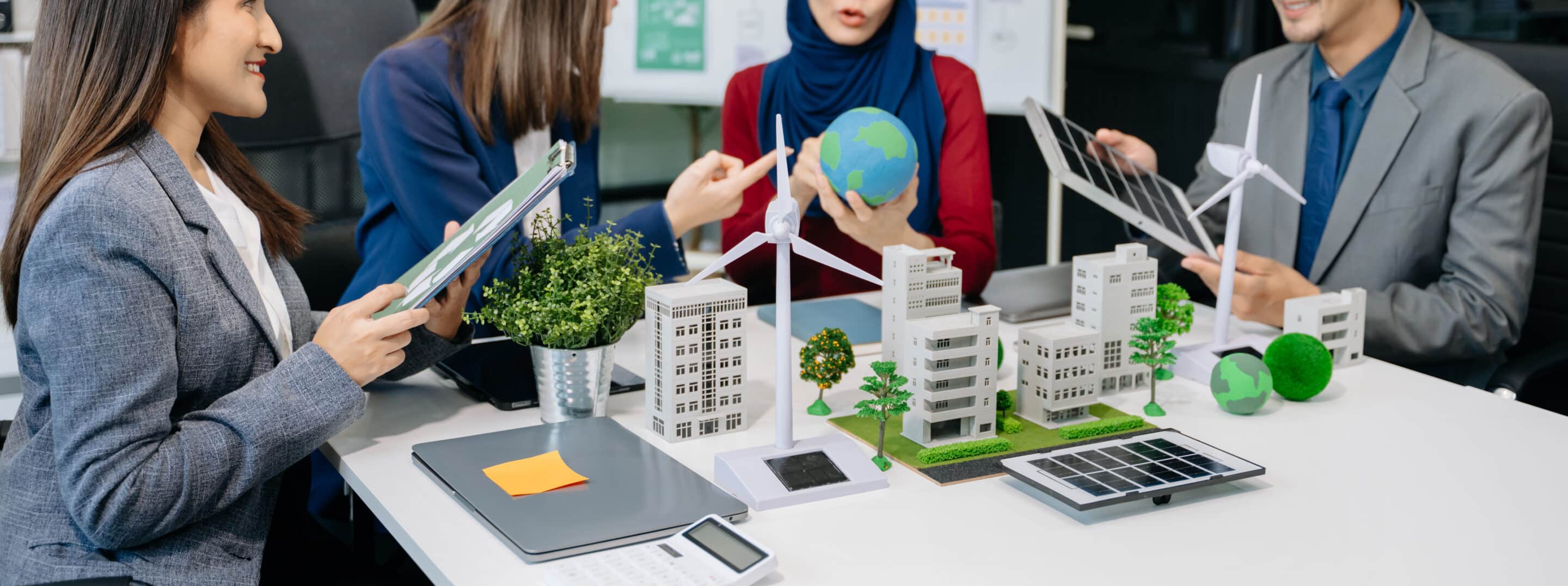 Business people having consultation about wind energy at company