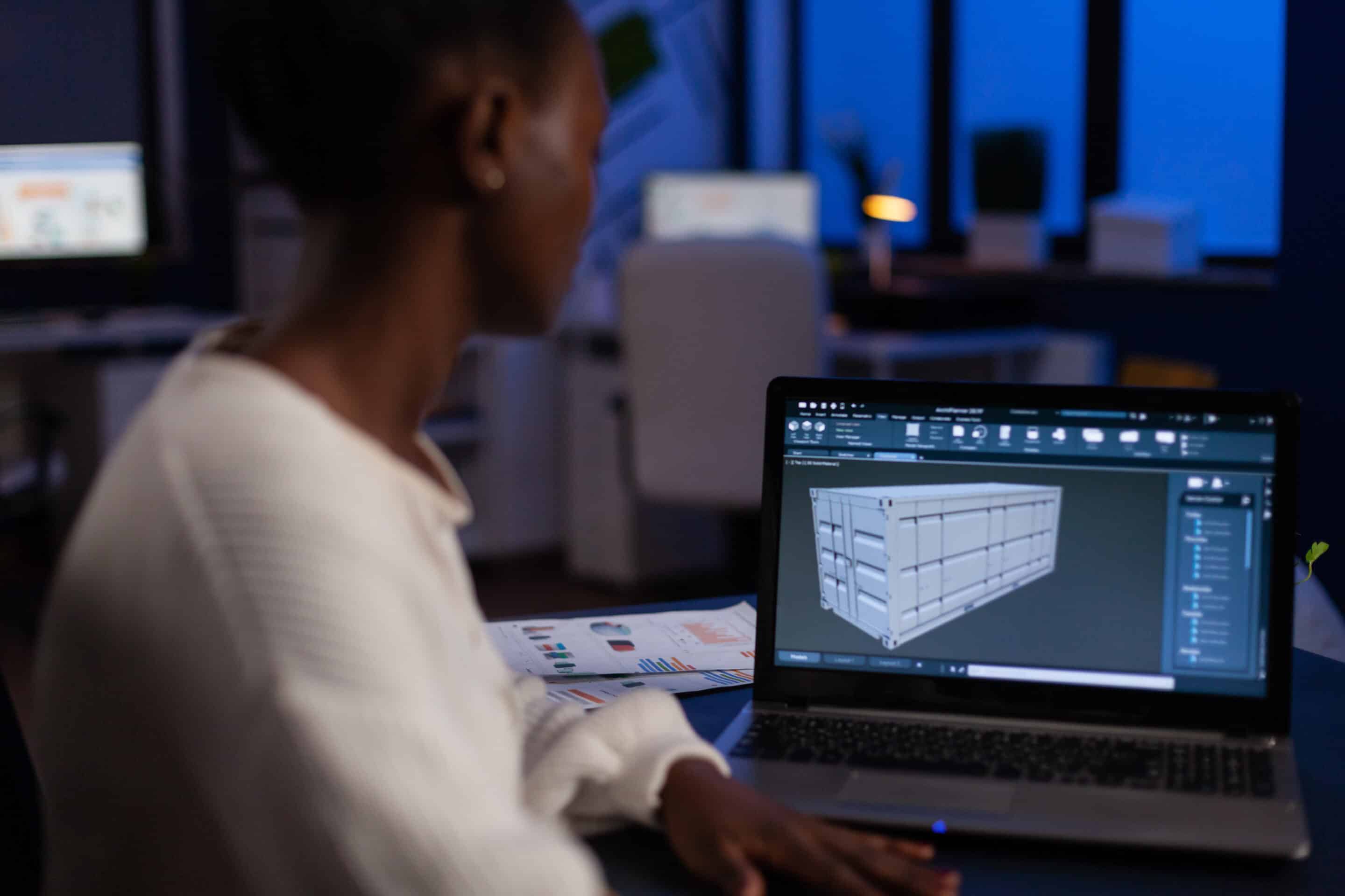 African american design arhitect working in 3D software developing prototype container idea GED de chantier